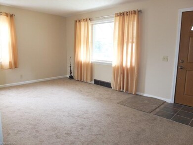 Living room with brand new carpet.