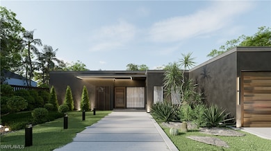 View of front of home featuring stucco siding, fen