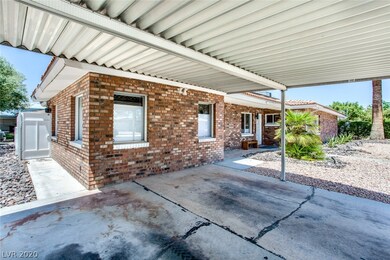 Exterior Front of home with 2-car carport, desert