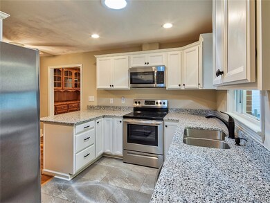 Side view of kitchen , beautiful white cabinets.