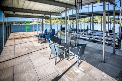 Huge seating area/swim platform that is 20' x 54' with two swim ladders.  The open portion for sunning is 12' x 22' and the rest is covered.  There is even more seating space on the other side with another swim ladder.