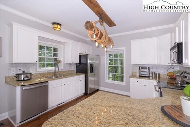 Open Kitchen with updated cabinets and backsplash.