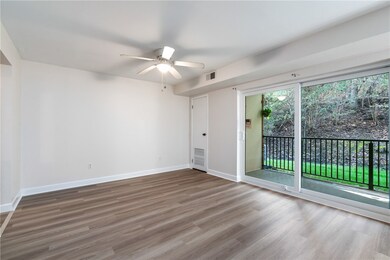 A ceiling fan/light combo illuminates the dining s