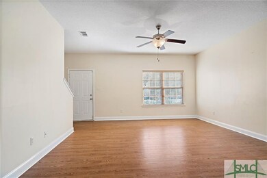Spacious living room with laminate flooring