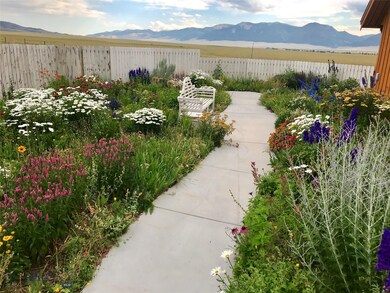The Secret Garden walkway with flowers flowers flo