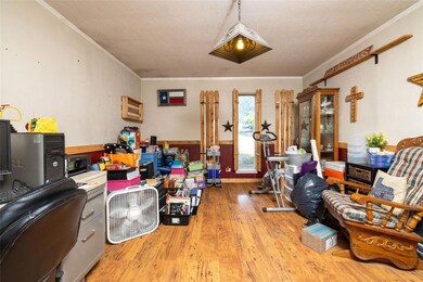 Living room featuring wood-type flooring, a textur