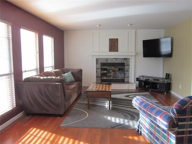 FAMILY ROOM WITH WOOD BURNING FIREPLACE