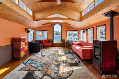 The houseboat opens into the kitchen, which is defined by its wide composition and intelligent layout.