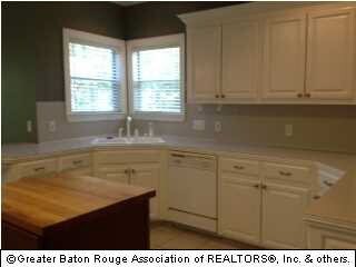 Another view of the built in cabinets and the kitc