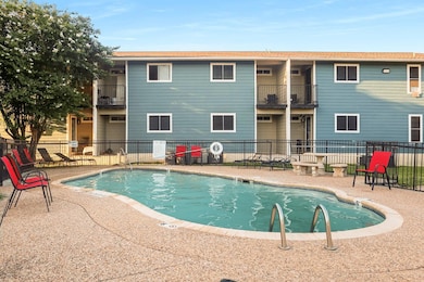 Community pool with a patio area