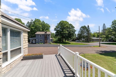 Wooden terrace with a lawn