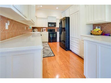 Kitchen. There is nothing cookie-cutter about this kitchen.  Note the solid surface countertops.