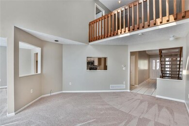 The family room has a pass through window into bot