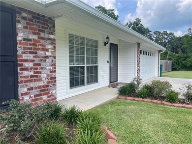 Well Maintained Flowerbeds and front porch