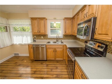 Maple kitchen cabinetry and Corian counters
