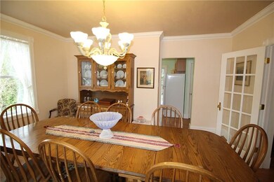 The crown moldings and laminate flooring continue 
