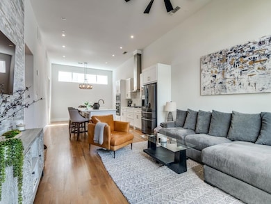 Living room featuring visible vents, recessed ligh