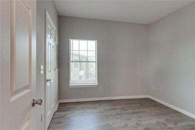 Entryway with light wood-style flooring and baseboards