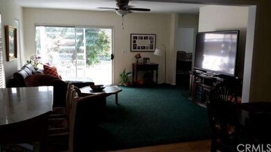VIEW FROM KITCHEN TO FAMILY RM AND BACK DECK
