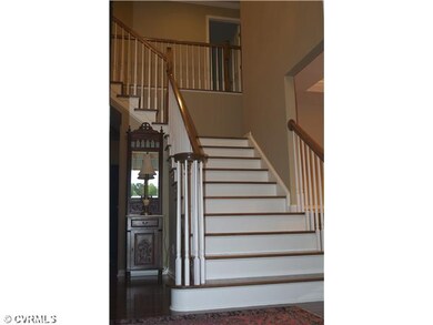 Foyer - Grant 2 story foyer with gleaming plank ha