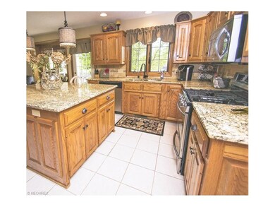 The updated kitchen is exquisite with ceramic tile