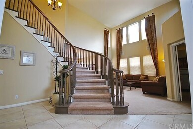 Dramatic entry to 2-story high ceilings and specta
