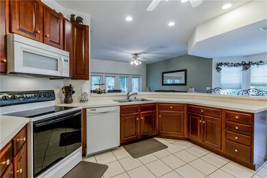 open kitchen with 42'' upper wood cabinets