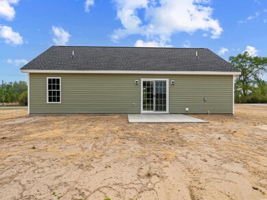 Back of property with a patio