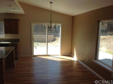 Family/dining room view of side patio