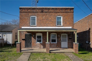 Multi unit property featuring brick siding and a p