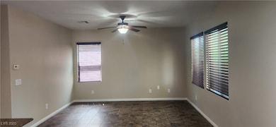 Spare room with ceiling fan and plenty of natural light