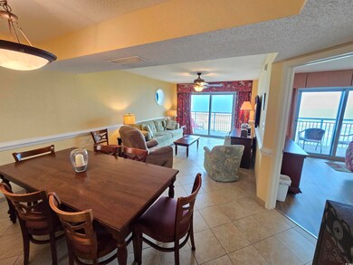 Dining space with light tile patterned flooring, a