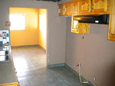 Kitchen area for stove and refrigerator