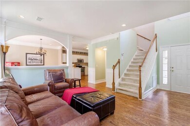 Enter to the sunny family room replete with an ope