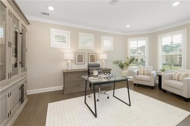 Spacious office or formal living room with plantat