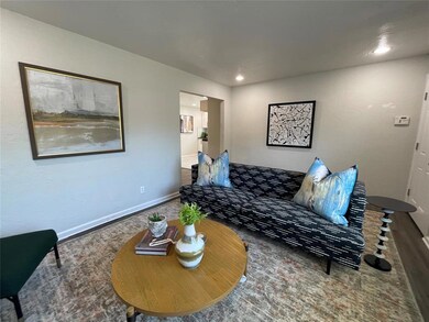 Living room with wood-type flooring