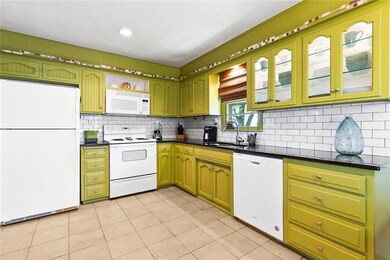 A large, cheerful Kitchen to accommodate multiple 