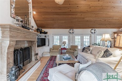 Family room with woodturning fireplace and built-i