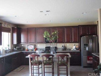 STUNNING KITCHEN WITH MAHOGANY STAIN CABINETS AND 