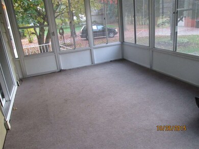 Screened in back porch overlooks both out building
