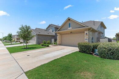 View of front of property featuring driveway, sto