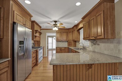 Kitchen sits between the formal dining and the bre