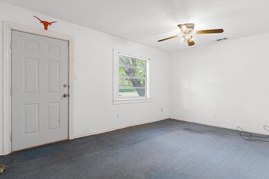 Unfurnished room featuring visible vents, a ceilin