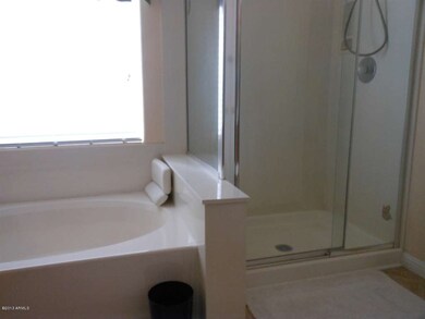 master bath showing tub and shower