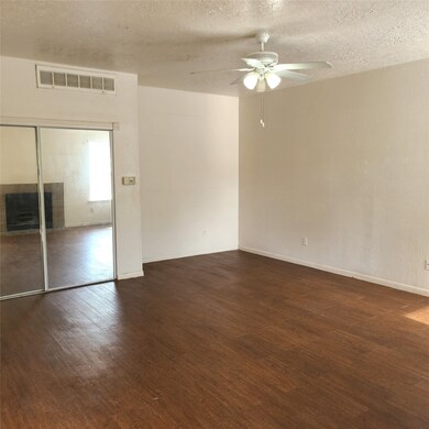 A Good Sized Closet with Mirrored Doors Helping th