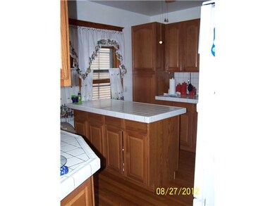 Kitchen Kitchen in lower with refinished hardwood 