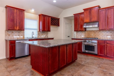 Spacious granite island with sleek stainless steel