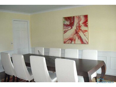 Dining room w/wood floor, wainscoting