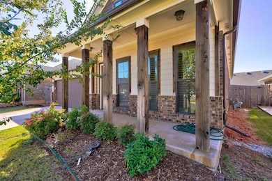 Entrance to property with a porch and a garage
