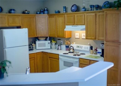 Kitchen opens up to dining area and living room; f